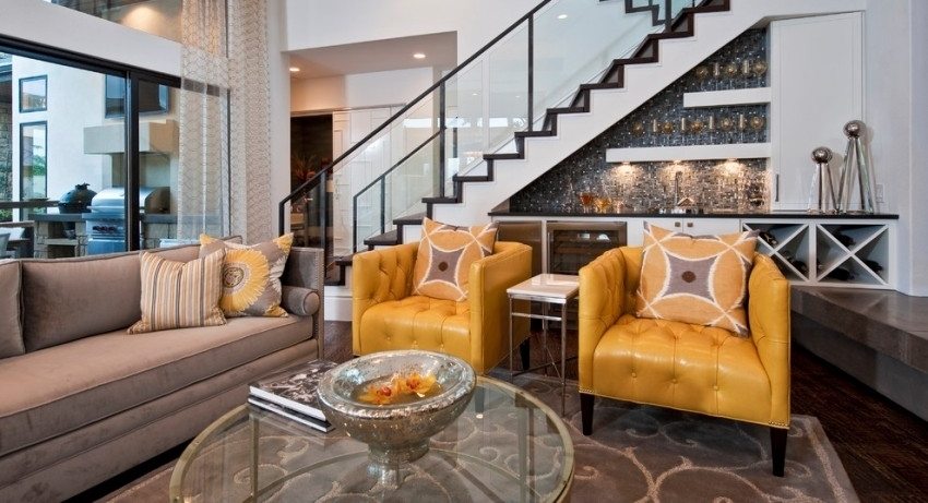 There is a kitchen under the stairs Stairs to the second floor in a private house: types of structures and materials