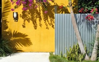 DIY fence made of corrugated board with columns: technique, assembly secrets