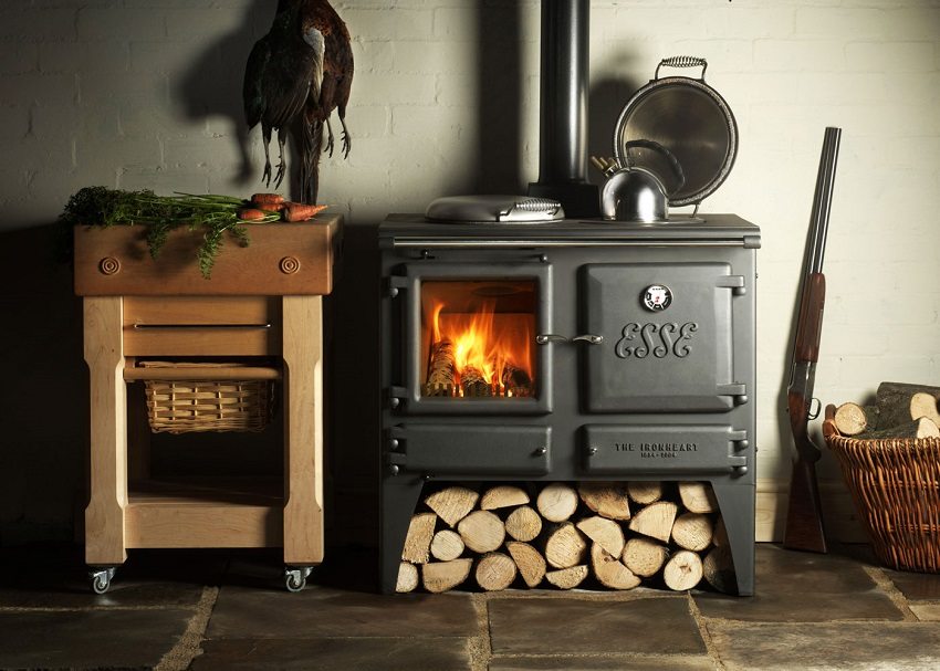 A stove-fireplace with a hob and an oven is a universal unit for cooking and autonomous heating of a country house A stove-fireplace with a hob and an oven is a universal unit for cooking and autonomous heating of a country house