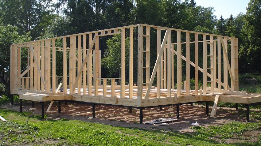 Lathing of a wooden frame of a house on a pile foundation Lathing of a wooden frame of a house on a pile foundation