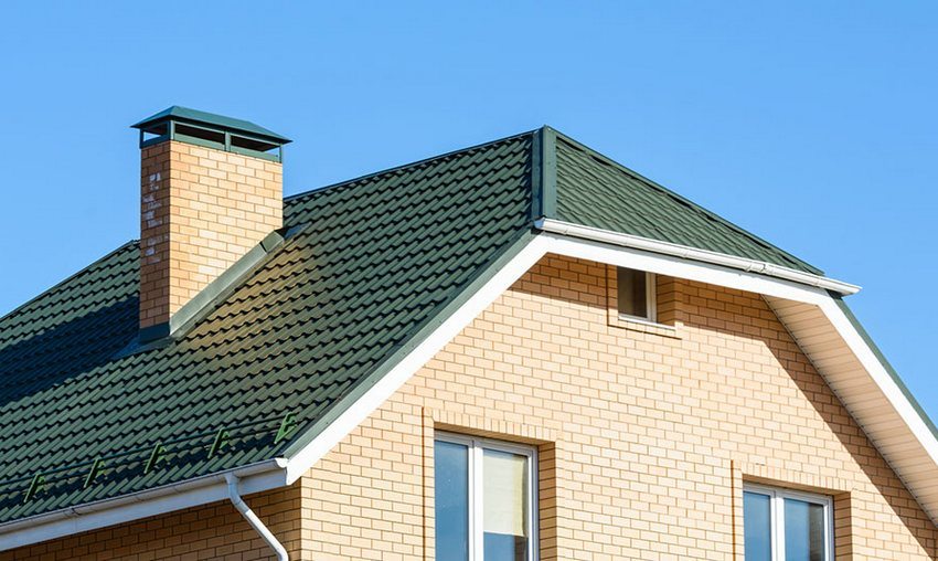 An example of a half-hip roof of a private house An example of a half-hip roof of a private house