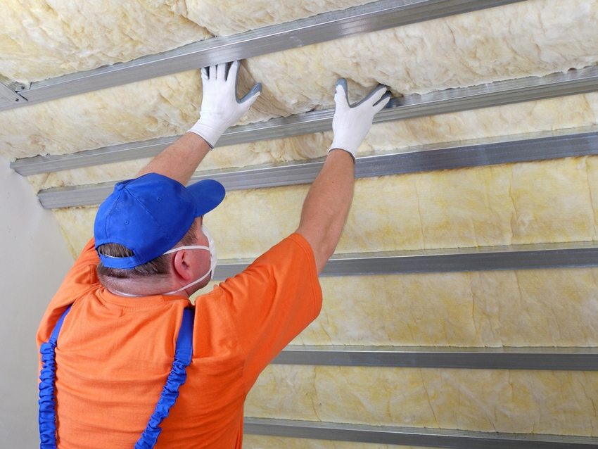 The process of insulating the attic roof using mineral wool The process of insulating the attic roof using mineral wool