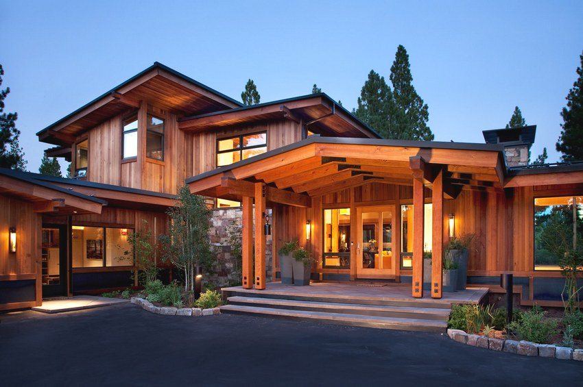 Log house with a complex combined roof Log house with a complex combined roof