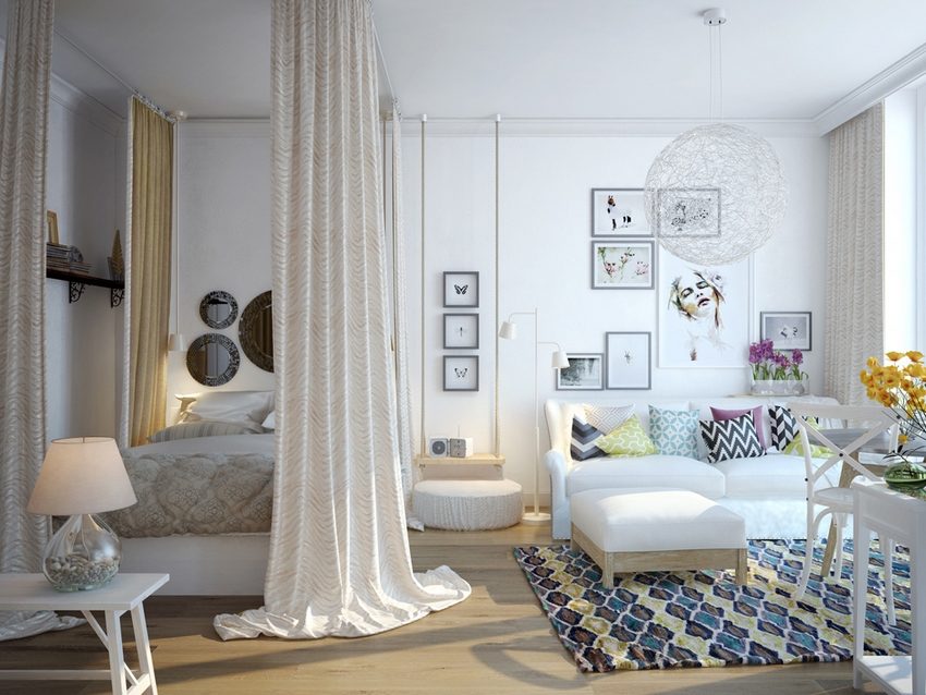 מקום שינה ומנוחה בדירת חדר מופרד על ידי מחיצת טקסטיל מקום שינה ומנוחה בדירת חדר מופרד על ידי מחיצת טקסטיל