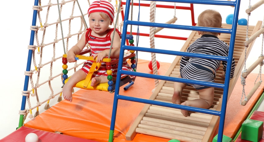 O complexo desportivo do apartamento permite não só divertir a criança, mas também fortalecer os músculos e as habilidades motoras Complexo esportivo infantil no apartamento: lazer interessante e desenvolvimento físico