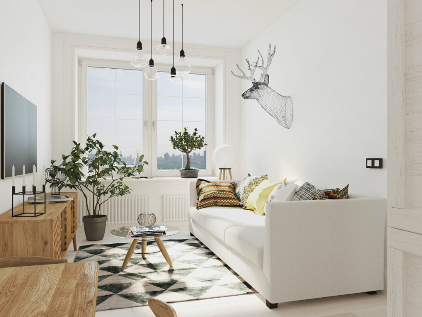 Interiér, vyzdobený v monochromatickej bielej farebnej schéme, vyzerá veľmi útulne kvôli výzdobe a izbovým rastlinám Interiér, vyzdobený v monochromatickej bielej farebnej schéme, vyzerá veľmi útulne kvôli výzdobe a izbovým rastlinám