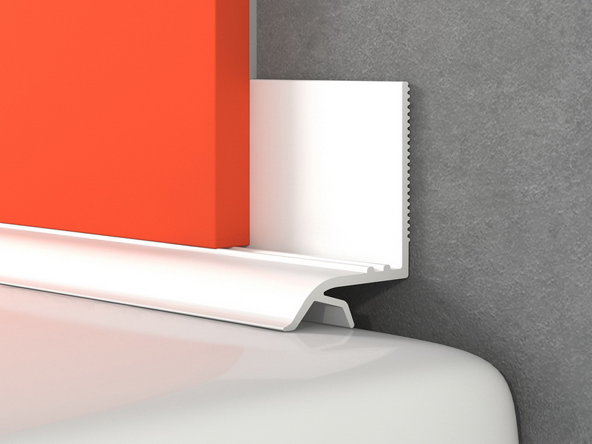 Et lim påføres på baksiden av fortauskanten og flisen plasseres på riktig sted