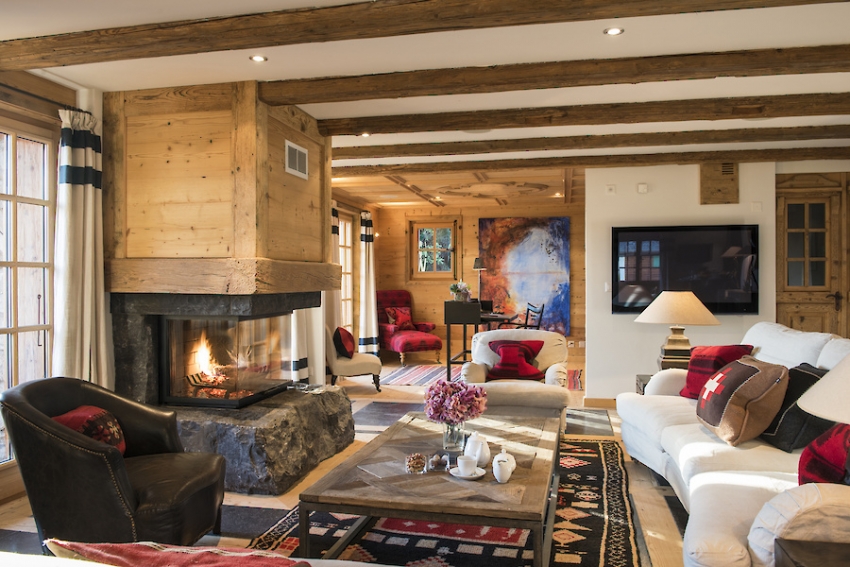 Ang paggamit ng kahoy bilang isang materyal na pagtatapos para sa fireplace ay ginagamit sa disenyo ng mga interior ng sala sa isang istilong simpleng bansa. Ang paggamit ng kahoy bilang isang materyal na pagtatapos para sa fireplace ay ginagamit sa disenyo ng mga interior ng sala sa isang istilong simpleng bansa.