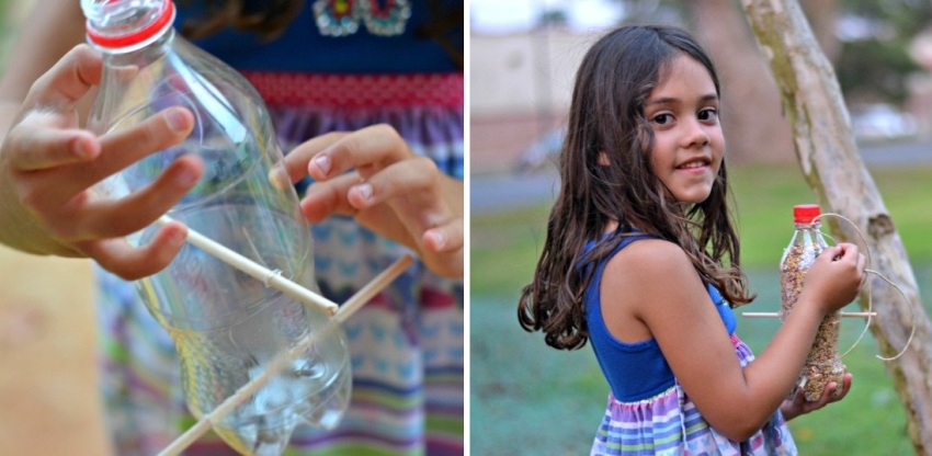 Prosty karmnik wykonany z plastikowej butelki i drewnianych żerdzi Prosty karmnik wykonany z plastikowej butelki i drewnianych żerdzi