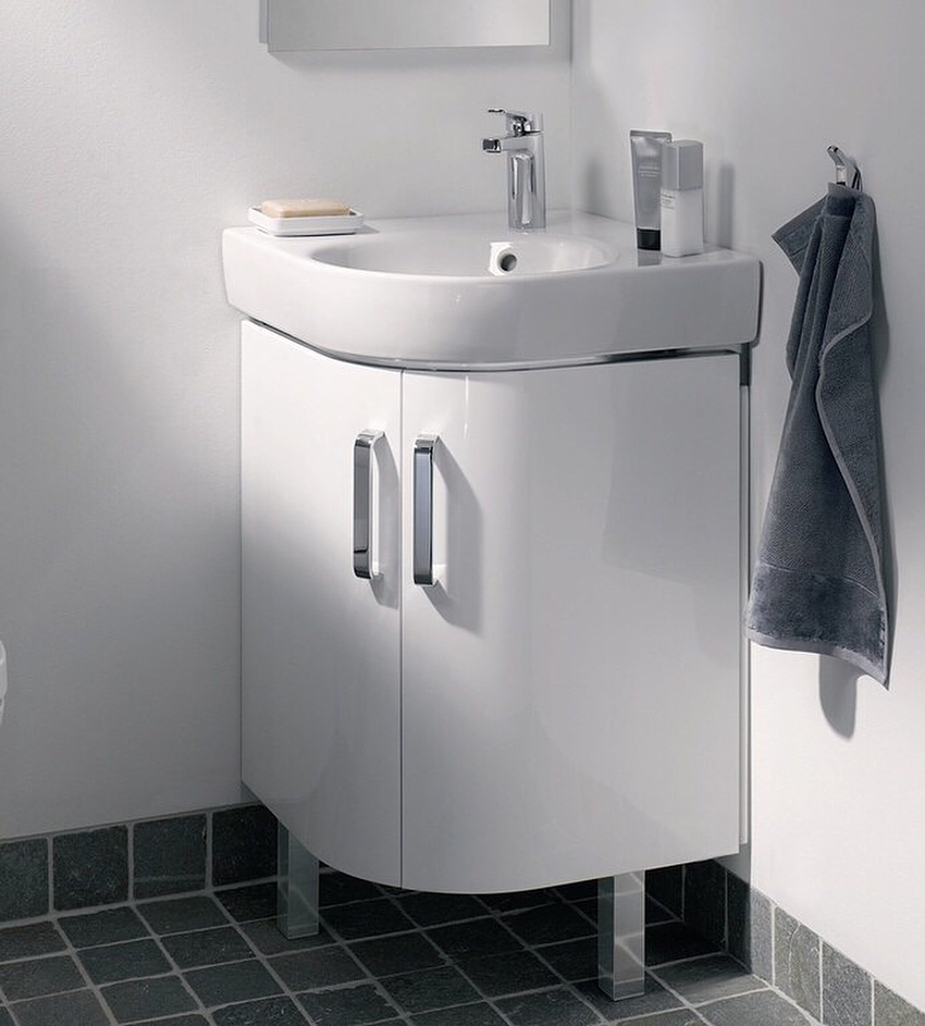 The corner model of the Altair-62 pedestal, with adjustable legs, is completed with a comfortable sink made of cast marble The corner model of the Altair-62 pedestal, with adjustable legs, is completed with a comfortable sink made of cast marble