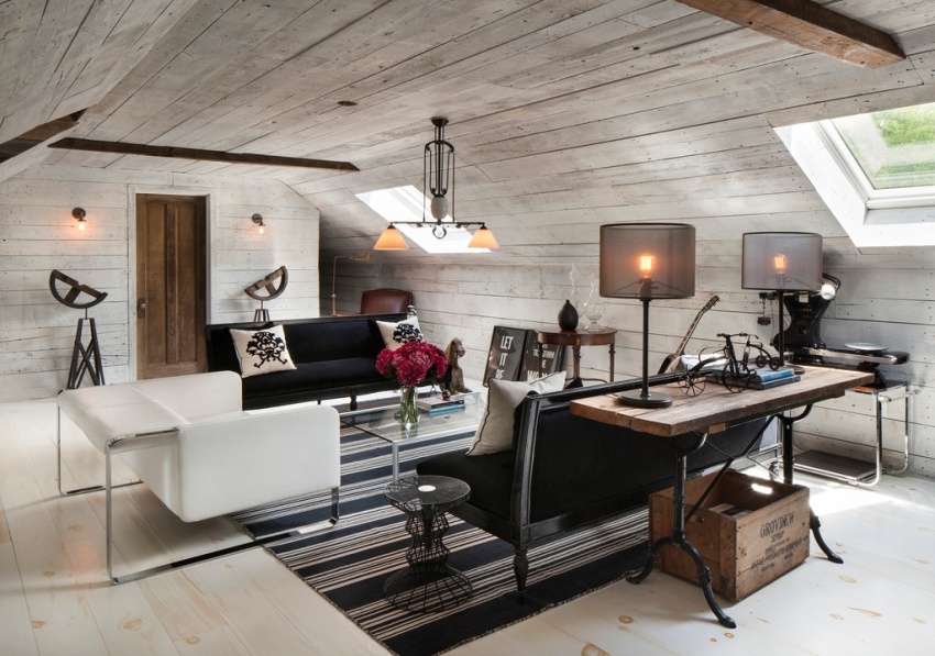 การผสมผสานกันอย่างลงตัวระหว่างเฟอร์นิเจอร์สีดำและสีขาวในห้องนั่งเล่นใต้หลังคา การผสมผสานกันอย่างลงตัวระหว่างเฟอร์นิเจอร์สีดำและสีขาวในห้องนั่งเล่นใต้หลังคา