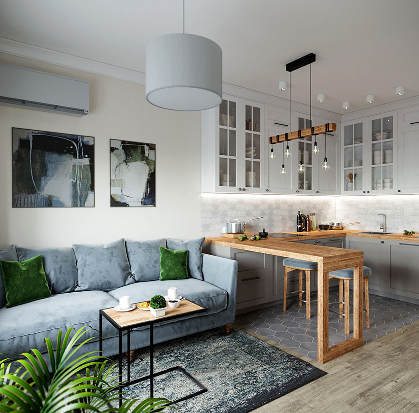 Uma cozinha combinada com uma sala de estar é uma solução comum em um interior escandinavo Uma cozinha combinada com uma sala de estar é uma solução comum em um interior escandinavo