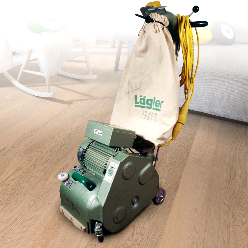 Båndsliberen har to aksler, hvorpå bæltet roterer Båndsliberen har to aksler, hvorpå bæltet roterer