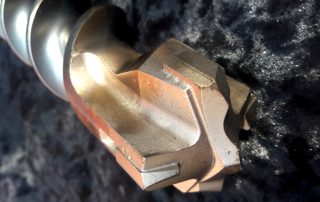 Bohrer für einen Perforator: die Wahl einer Schlagschneiddüse, deren Zweck